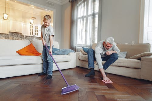 A family cleaning their house together.