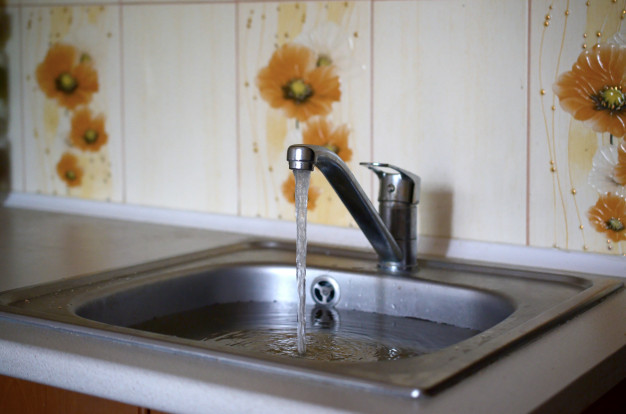 a kitchen sink with slow drain